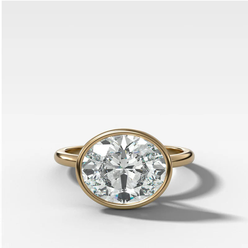 Penumbra Bezel Set Engagement Ring With East West Oval Cut