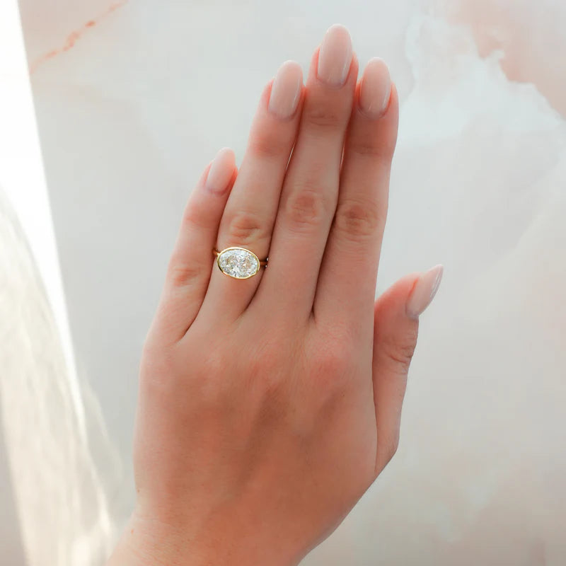 Penumbra Bezel Set Engagement Ring With East West Oval Cut