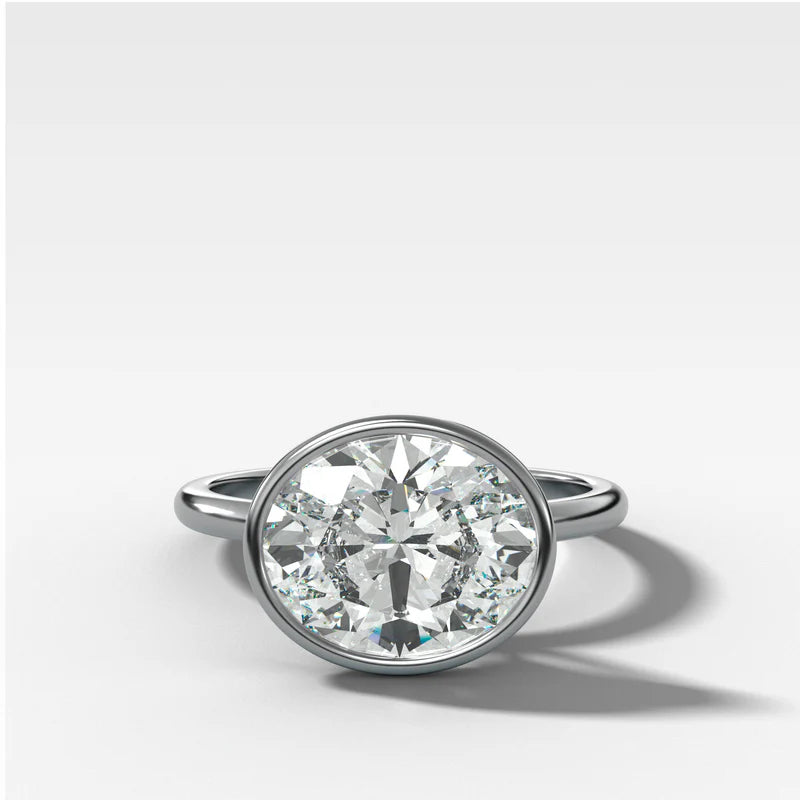 Penumbra Bezel Set Engagement Ring With East West Oval Cut