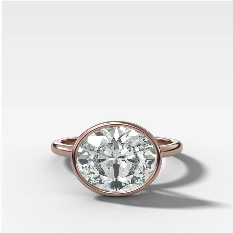 Penumbra Bezel Set Engagement Ring With East West Oval Cut
