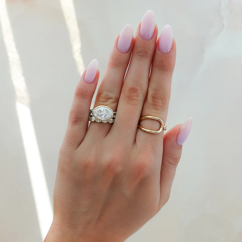 Penumbra Bezel Set Engagement Ring With East West Oval Cut