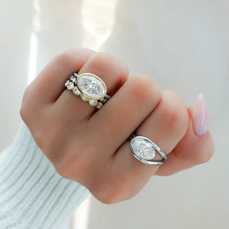 Penumbra Bezel Set Engagement Ring With East West Oval Cut