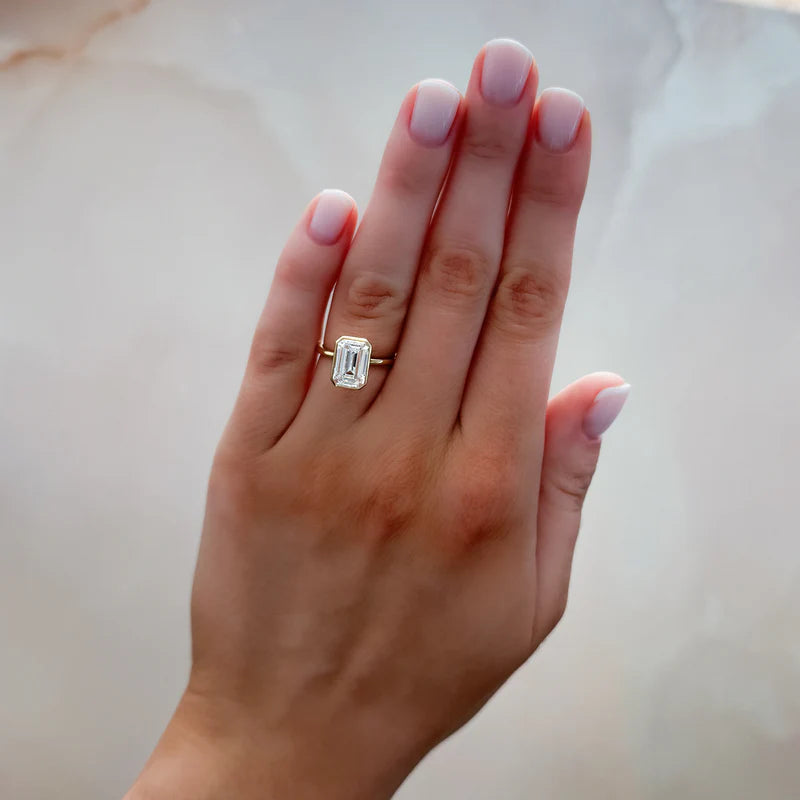 Penumbra Bezel Set Engagement Ring With Emerald Cut