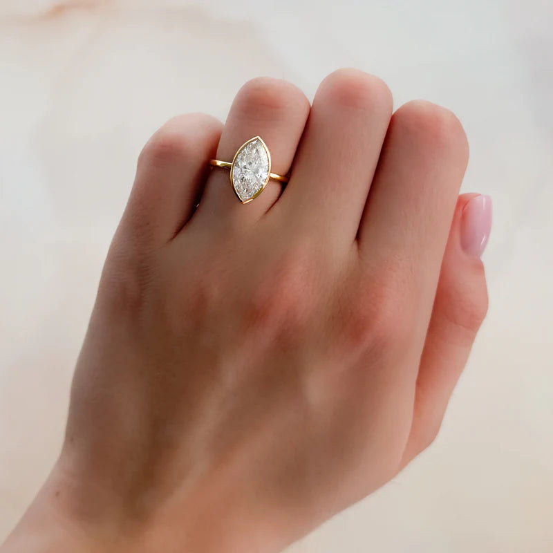 Penumbra Bezel Set Engagement Ring With Marquise Cut