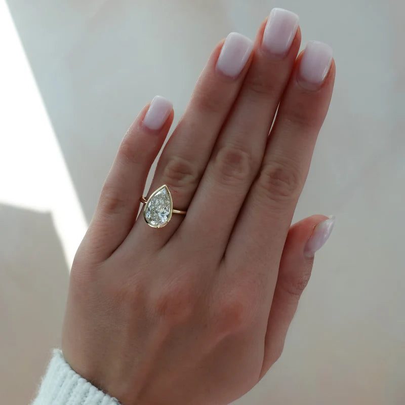 Penumbra Bezel Set Engagement Ring With Pear Cut