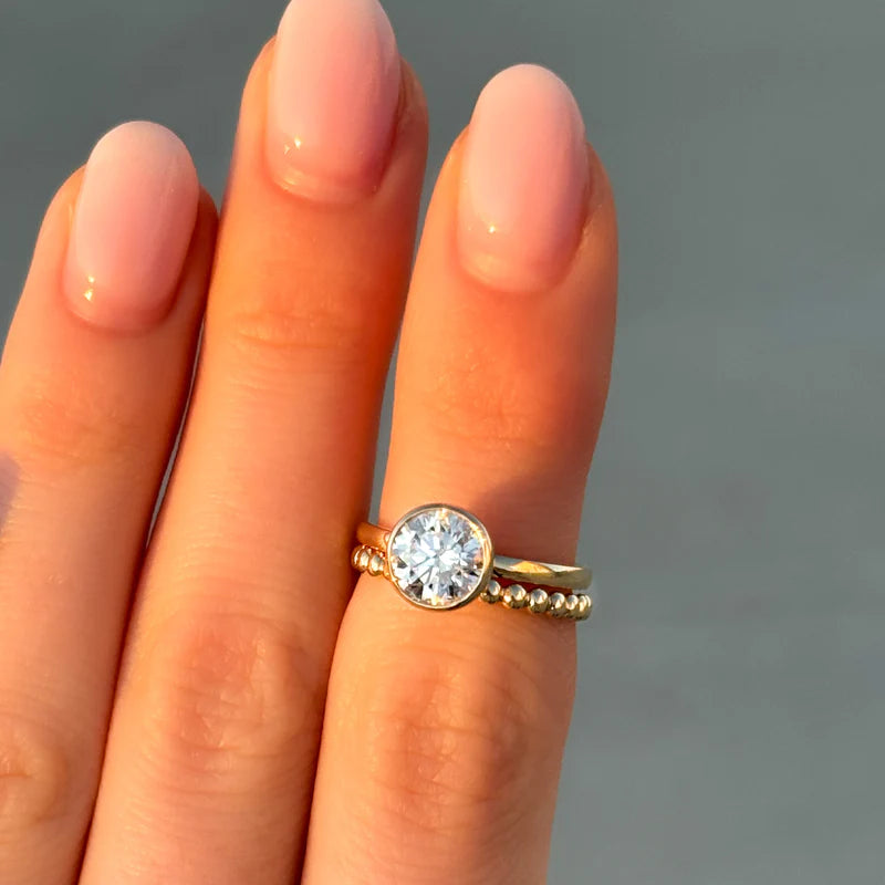 Penumbra Bezel Set Engagement Ring With Round Cut