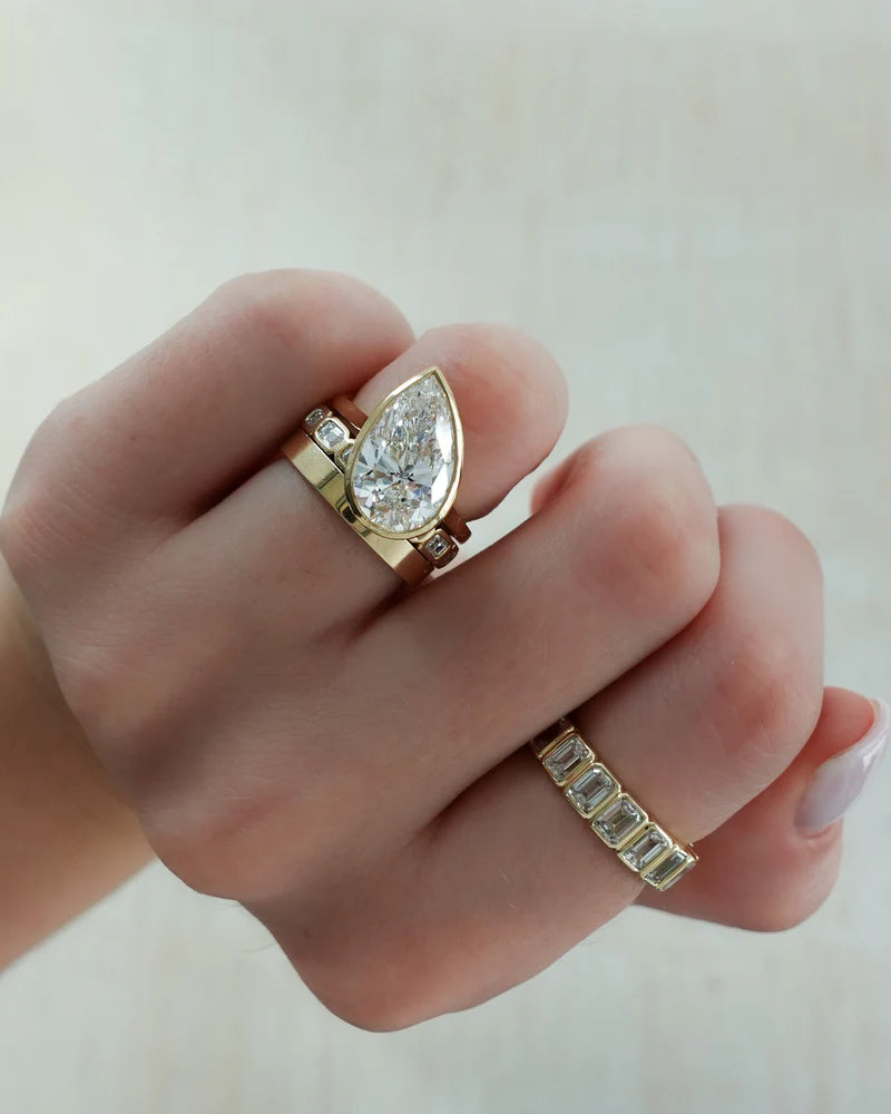 Penumbra Bezel Set Engagement Ring With Tilted Pear Cut