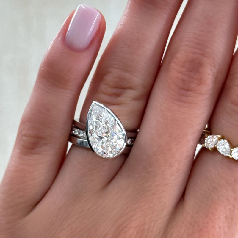 Penumbra Bezel Set Engagement Ring With Tilted Pear Cut