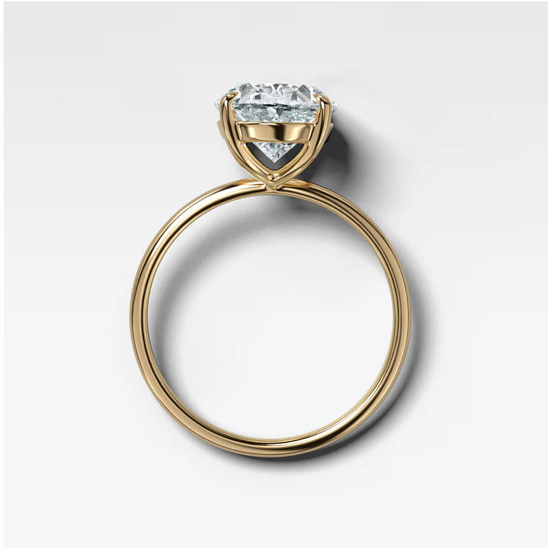Thin + Simple Solitaire Engagement Ring With Oval Cut Diamond