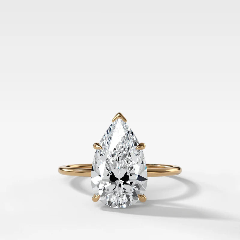 Thin + Simple Solitaire Engagement Ring With Pear Cut Diamond