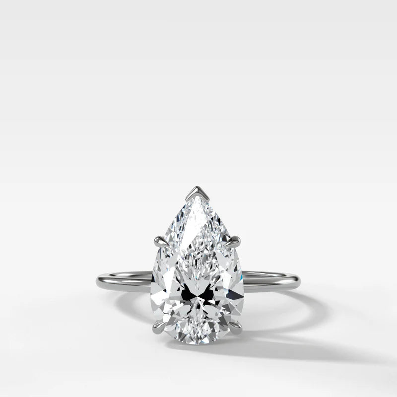 Thin + Simple Solitaire Engagement Ring With Pear Cut Diamond
