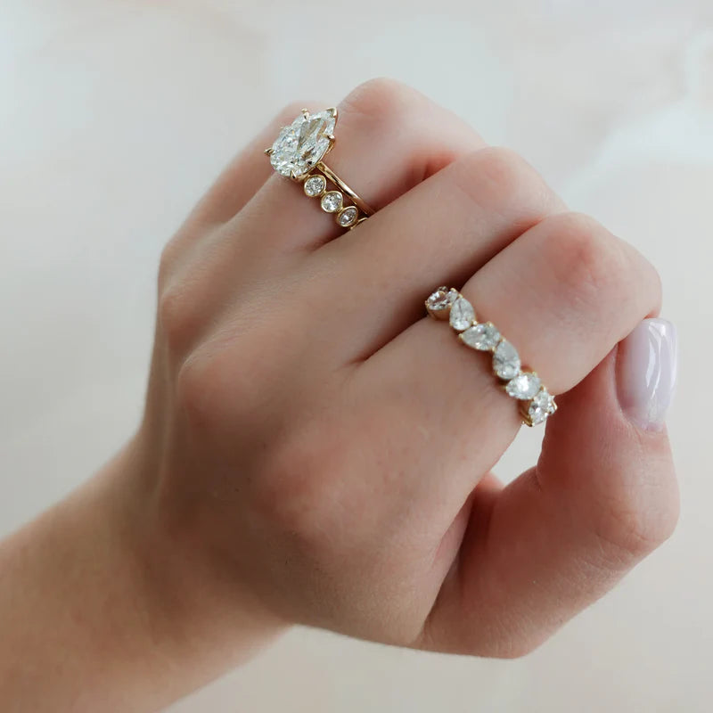 Thin + Simple Solitaire Engagement Ring With Pear Cut Diamond