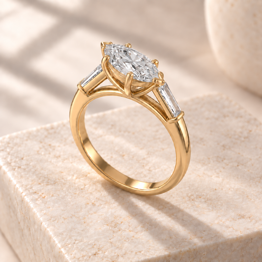 Aster marquise lab-grown diamond ring with tapered baguette sides in yellow gold, three quarter design preview