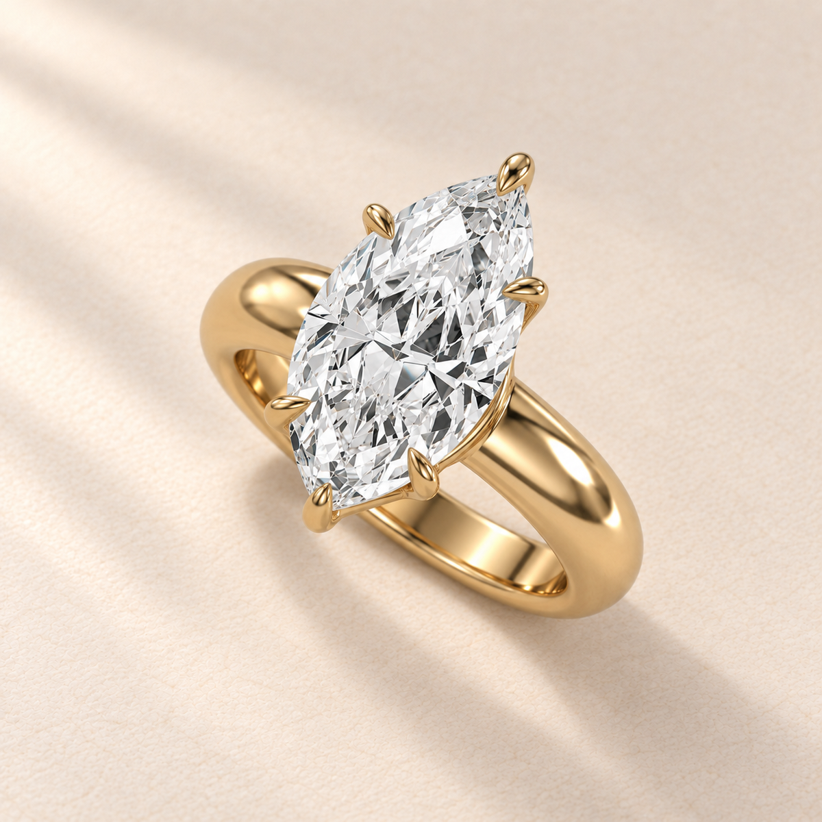 Solara Marquise Domed Solitaire Ring in yellow gold, high oblique view