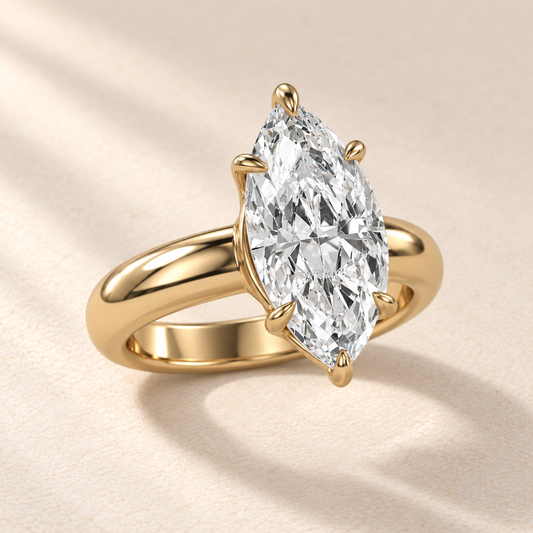 Solara Marquise Domed Solitaire Ring in yellow gold, three quarter view