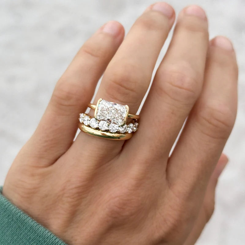 East West Half Bezel Solitaire Engagement Ring With Elongated Radiant Cut Diamond