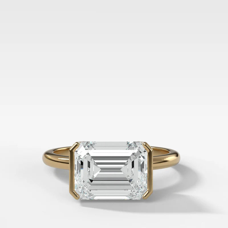 East West Half Bezel Solitaire Engagement Ring With Emerald Cut Diamond