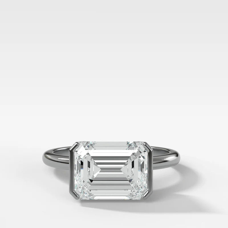 East West Half Bezel Solitaire Engagement Ring With Emerald Cut Diamond