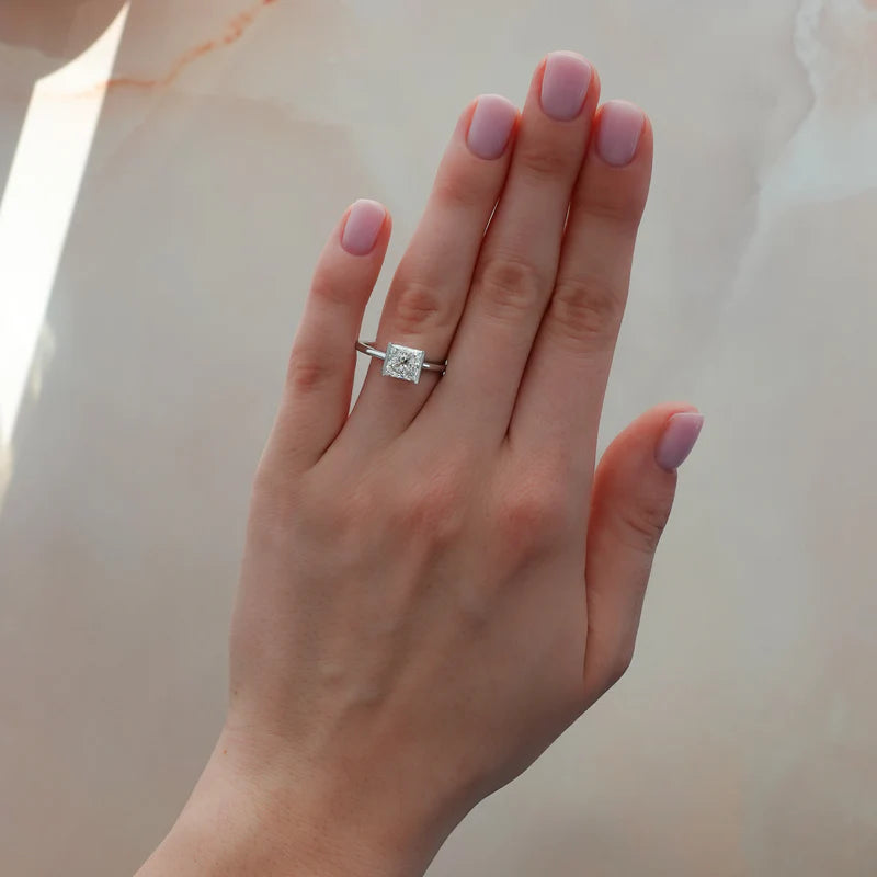 Half Bezel Solitaire Engagement Ring With Princess Cut Diamond