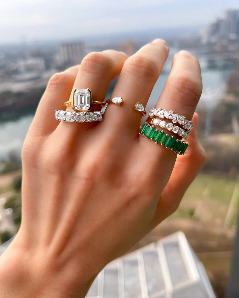 North South Half Bezel Solitaire Engagement Ring With Emerald Cut Diamond