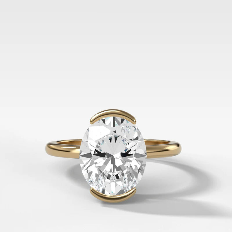 North South Half Bezel Solitaire Engagement Ring With Oval Cut Diamond