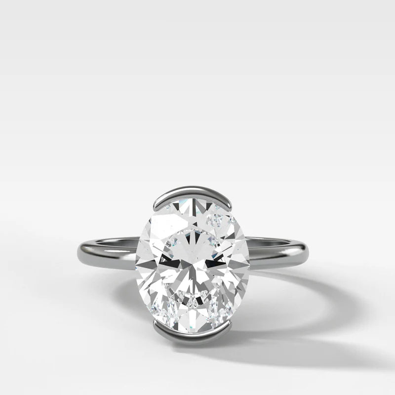 North South Half Bezel Solitaire Engagement Ring With Oval Cut Diamond