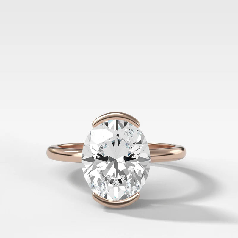 North South Half Bezel Solitaire Engagement Ring With Oval Cut Diamond