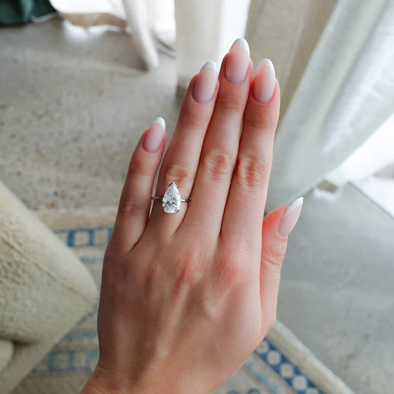 North South Half Bezel Solitaire Engagement Ring With Pear Cut Diamond
