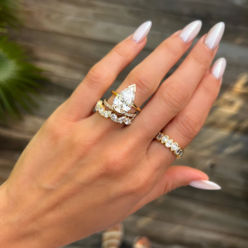 North South Half Bezel Solitaire Engagement Ring With Pear Cut Diamond