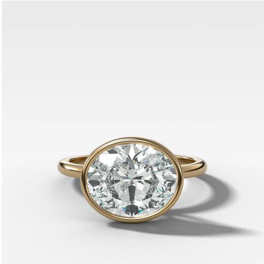 Penumbra Bezel Set Engagement Ring With East West Oval Cut