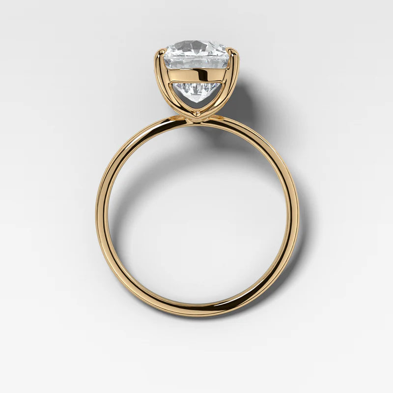 Thin + Simple Solitaire Engagement Ring With Elongated Cushion Cut Diamond
