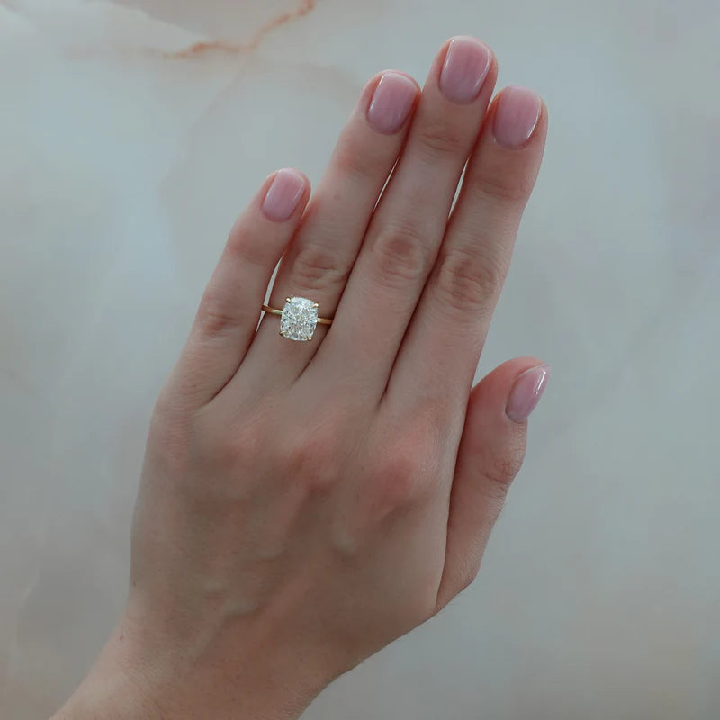 Thin + Simple Solitaire Engagement Ring With Elongated Cushion Cut Diamond