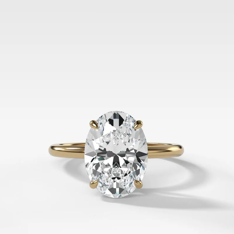 Thin + Simple Solitaire Engagement Ring With Oval Cut Diamond