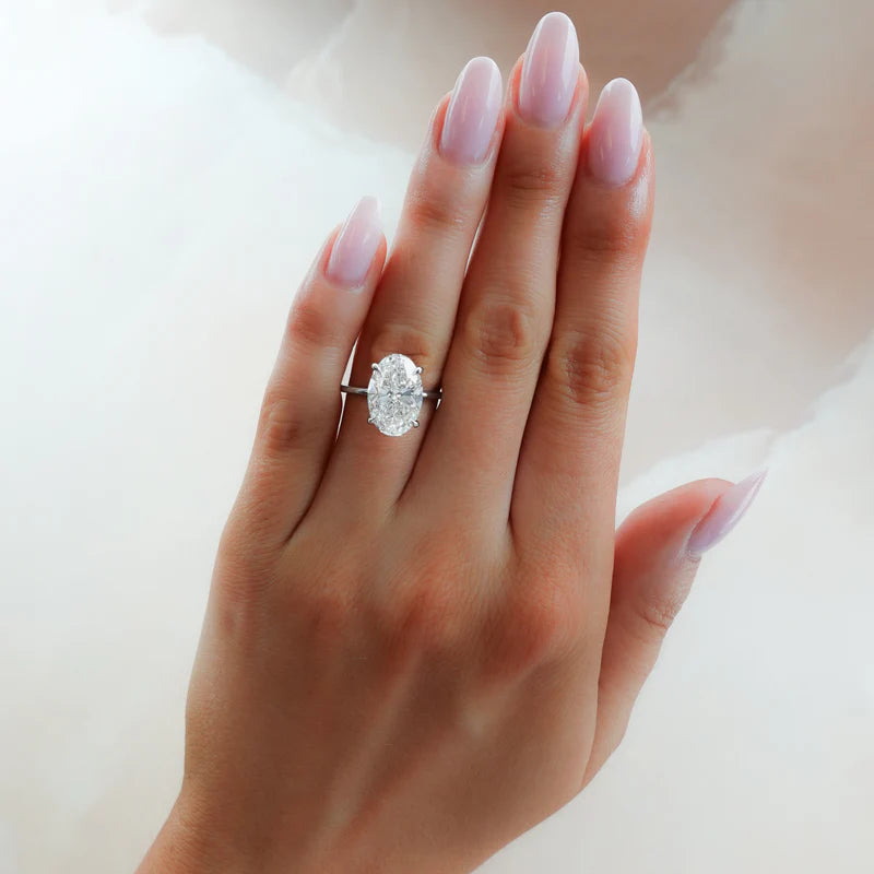 Thin + Simple Solitaire Engagement Ring With Oval Cut Diamond