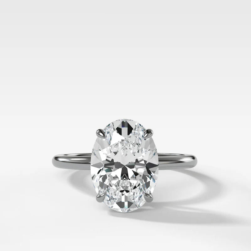 Thin + Simple Solitaire Engagement Ring With Oval Cut Diamond