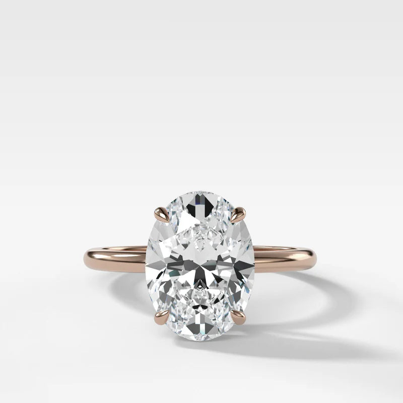 Thin + Simple Solitaire Engagement Ring With Oval Cut Diamond