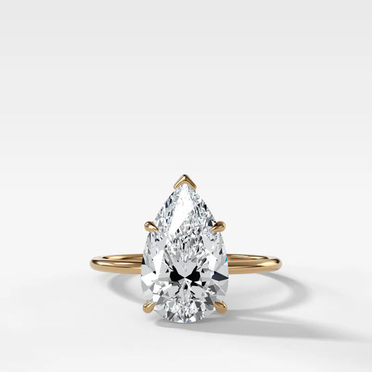 Thin + Simple Solitaire Engagement Ring With Pear Cut Diamond