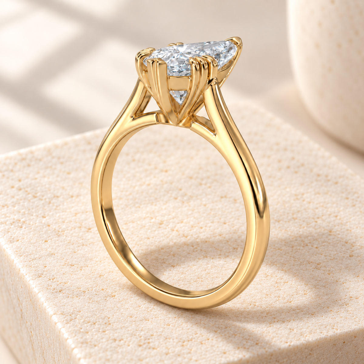 Altara Pear Cathedral Ring in yellow gold on cream stone, rear view