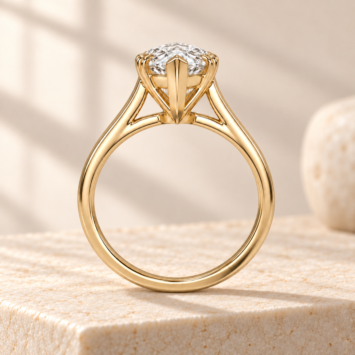 Altara Pear Cathedral Ring in yellow gold on cream stone, side view
