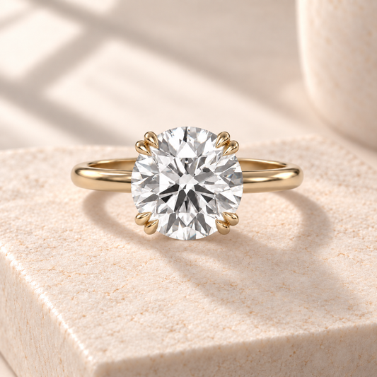 Altara Round Cathedral Ring in yellow gold on cream stone, front view