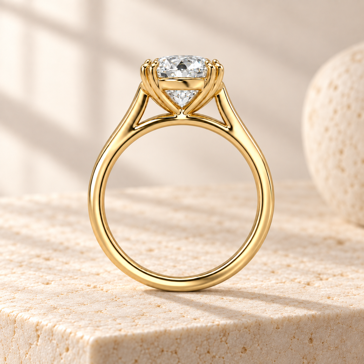 Altara Round Cathedral Ring in yellow gold on cream stone, side view