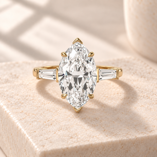 Aster marquise lab-grown diamond ring with tapered baguette sides in yellow gold, front design preview