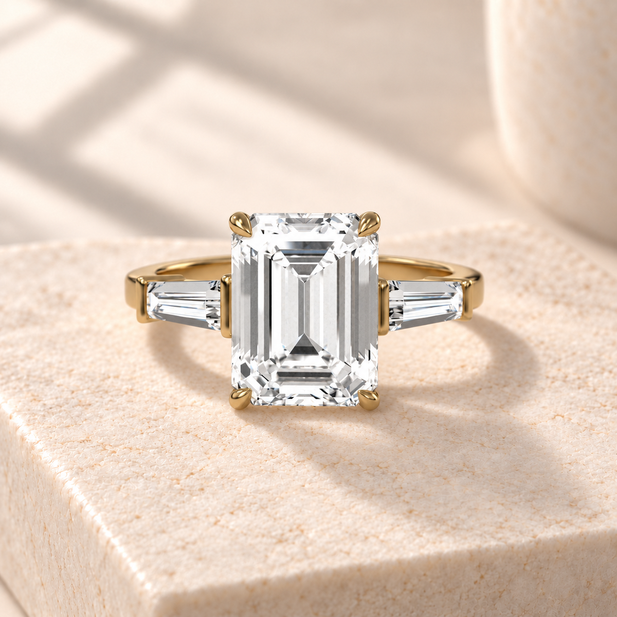 Aster north-south emerald-cut lab-grown diamond ring with tapered baguette side diamonds in yellow gold, front design preview