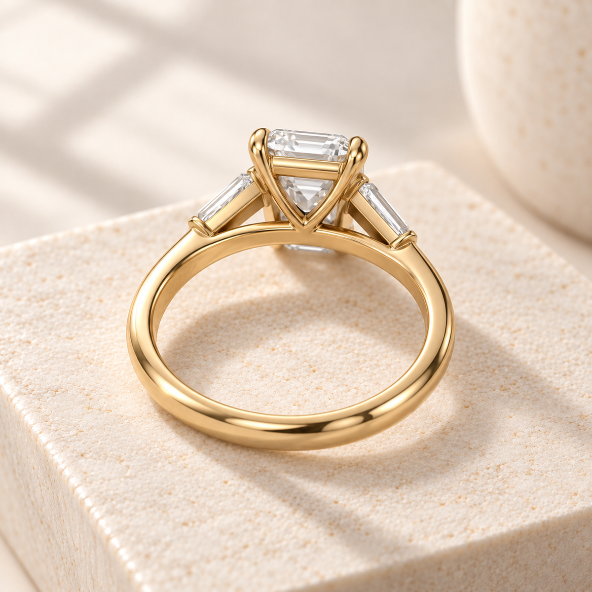 Aster north-south emerald-cut lab-grown diamond ring with tapered baguette side diamonds in yellow gold, rear design preview