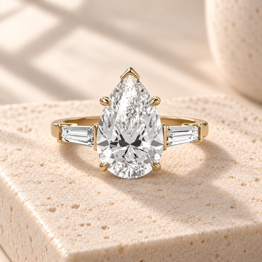 Aster pear-cut lab-grown diamond ring with tapered baguette side diamonds in yellow gold, front design preview