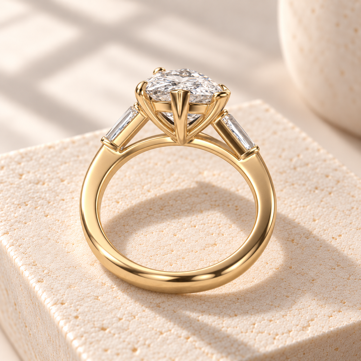 Aster pear-cut lab-grown diamond ring with tapered baguette side diamonds in yellow gold, rear design preview