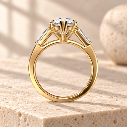 Aster pear-cut lab-grown diamond ring with tapered baguette side diamonds in yellow gold, side design preview