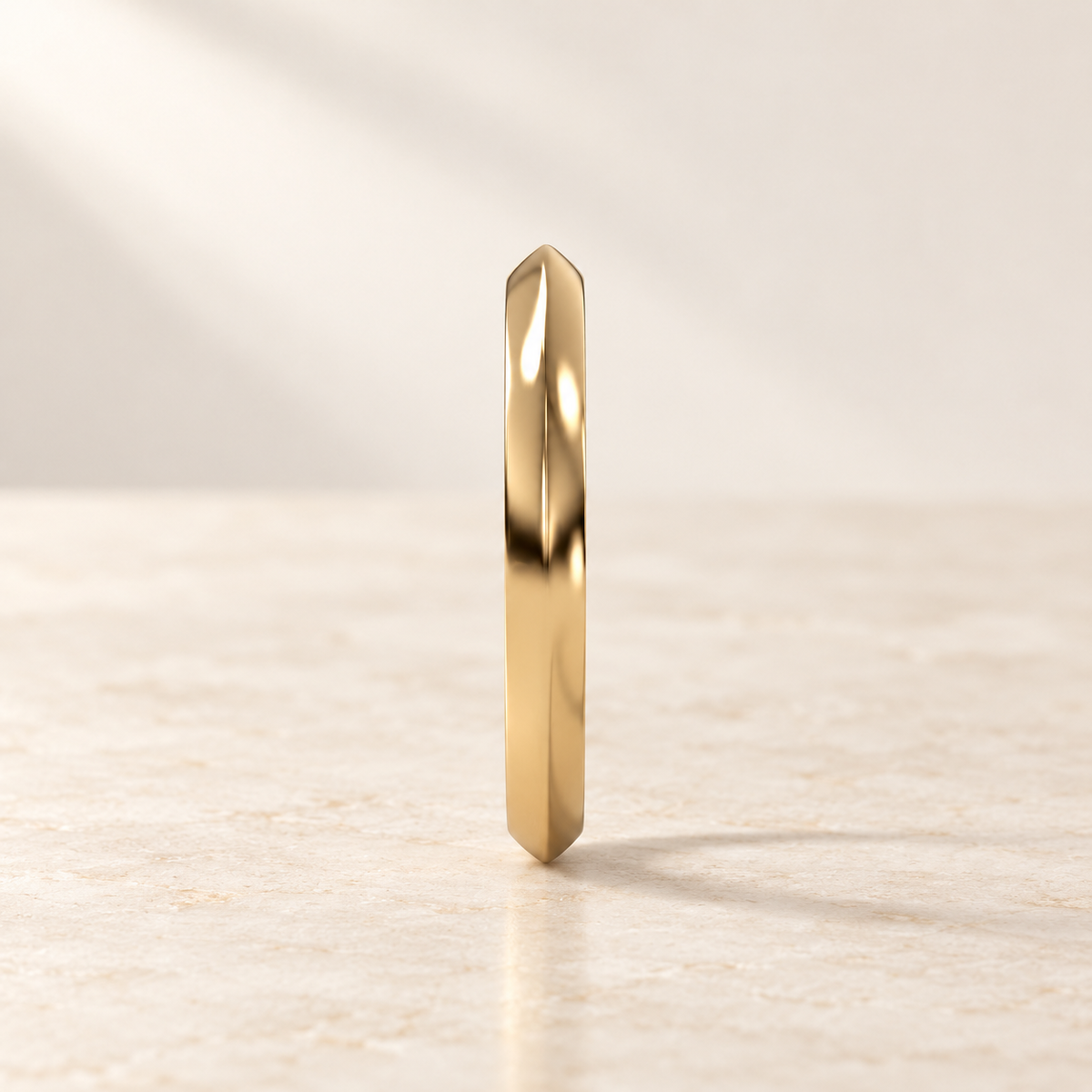 AI product preview of one Astra Knife-Edge Hoop Earring in yellow gold, front view of the knife edge