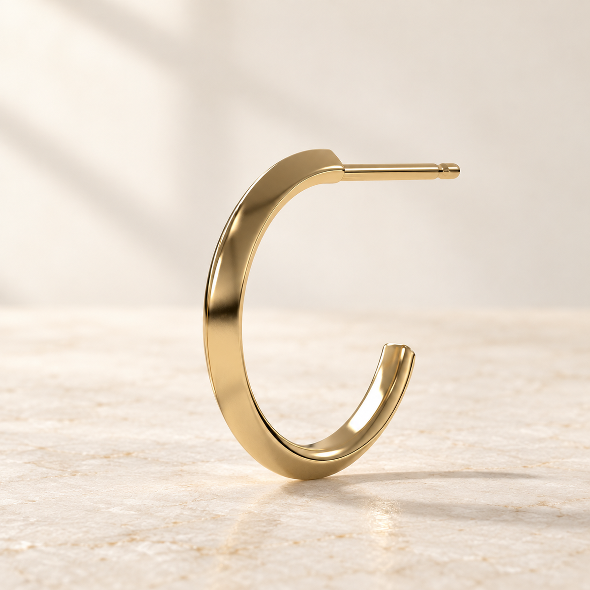 AI product preview of one Astra Knife-Edge Hoop Earring in yellow gold, side profile with straight post