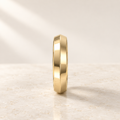 AI product preview of Astra Wide Knife-Edge Wedding Band in yellow gold, edge profile